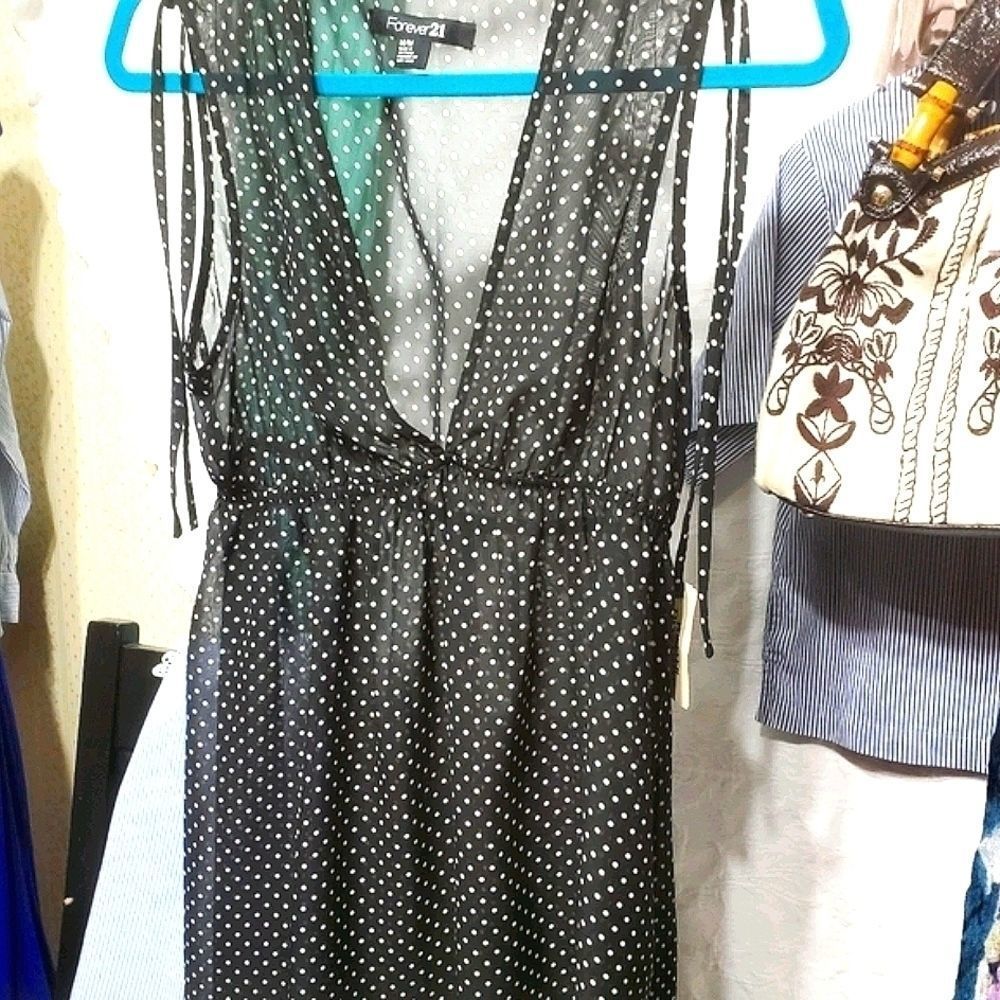 NWT Sleeveless sheer baby doll tunic